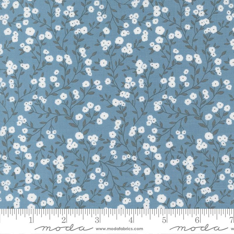 Blue fabric with white flowers and grey stems with leaves